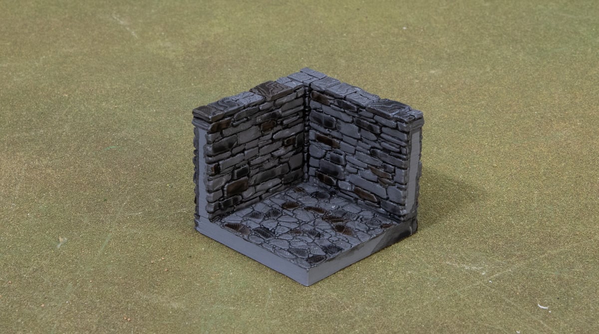 3D printed and painted dungeon tiles with bricks picked out with a wash