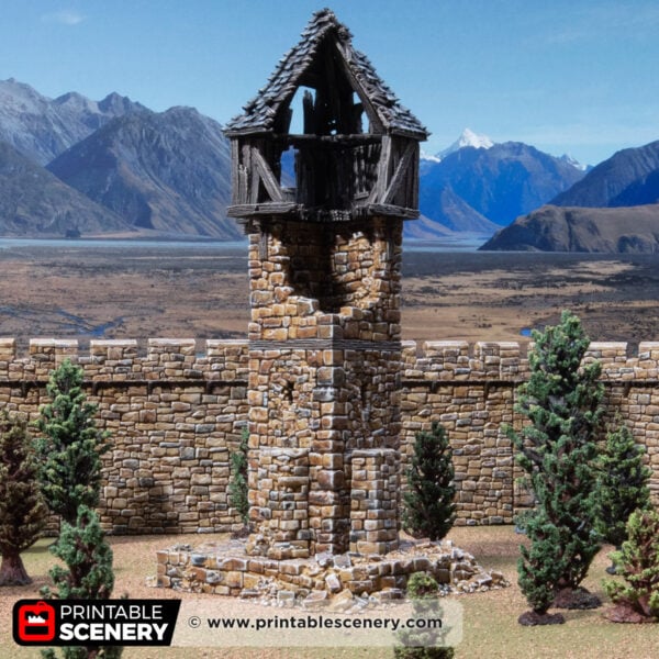 3D printed and painted ruined millbury tower against a mountain backdrop, for dnd and wargames