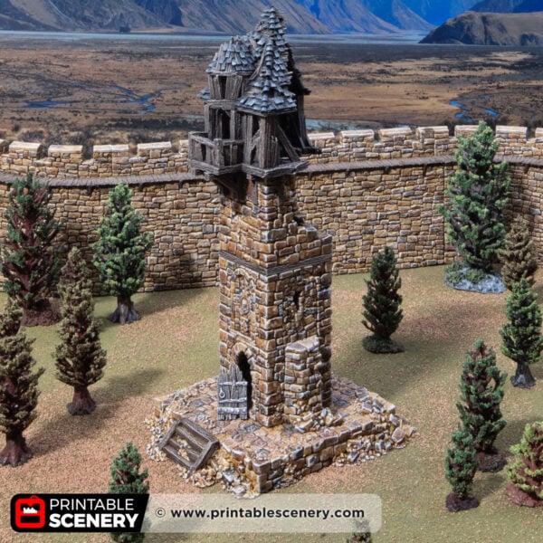 3D printed and painted ruined millbury tower against a mountain backdrop, for dnd and wargames