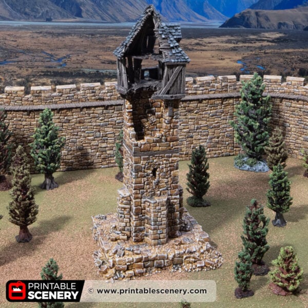 3D printed and painted ruined millbury tower against a mountain backdrop, for dnd and wargames