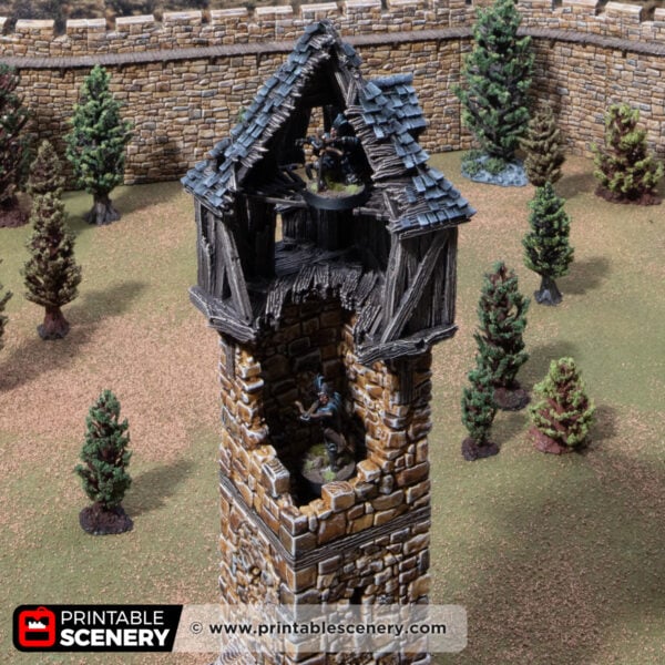 3D printed and painted ruined millbury tower against a mountain backdrop, for dnd and wargames