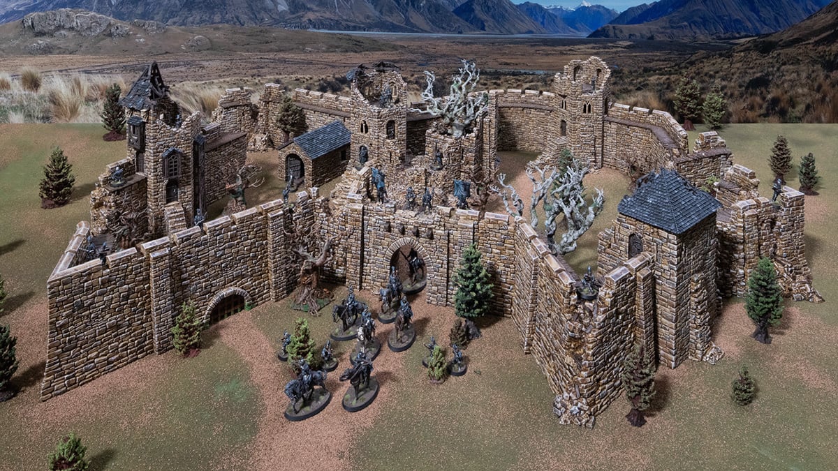 a 3D printed and painted ruined castle with soldiers manned on the walls for tabletop rpgs and wargames