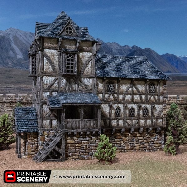 3D printed and painted Wattle & Daub Living Quarters model for wargames and rpgs on a mountain backdrop