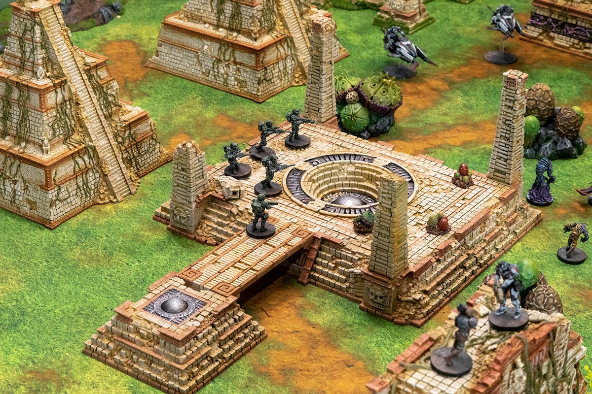 3d printed and painted Alien planet wargaming board with miniatures on display