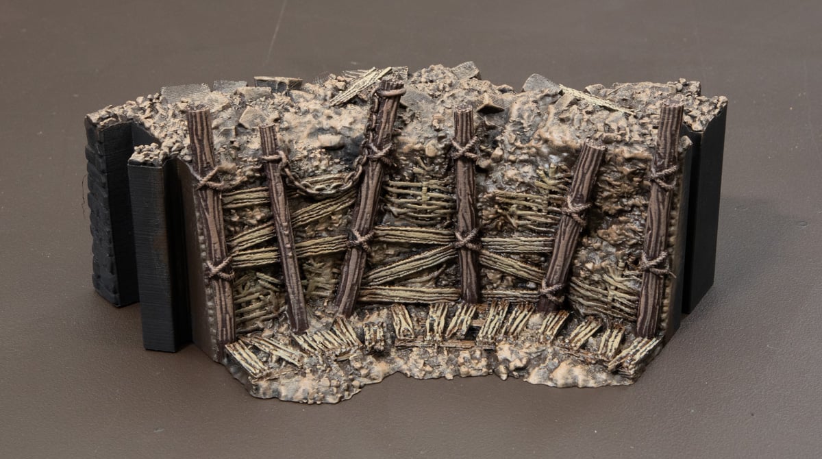 3D printed Trench Wall with posts drybrushed with German Camo Pale Brown